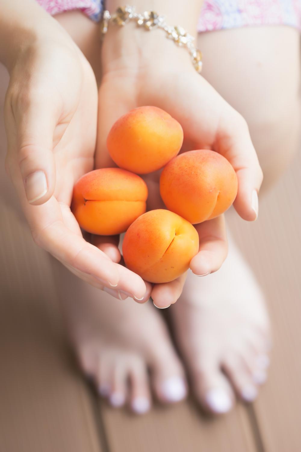 Cousin holding apricots 